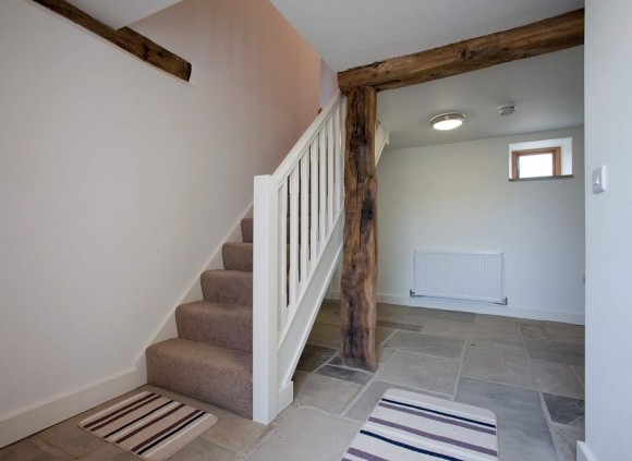 The stairs lead to a further 3 bedrooms on the first floor.