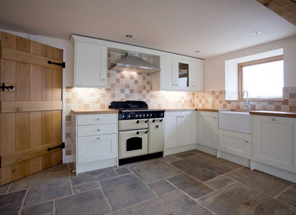 The open plan kitchen features a York stone flagged floor.