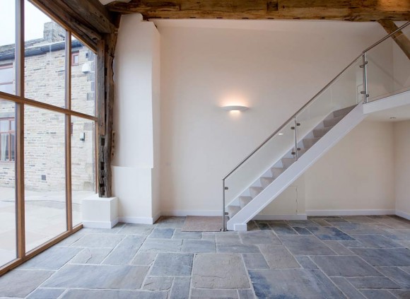 Open staircase leading upstairs from the large, open plan living space on the ground floor.